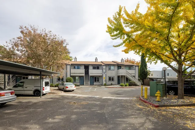 a view of a car park in front of a building
