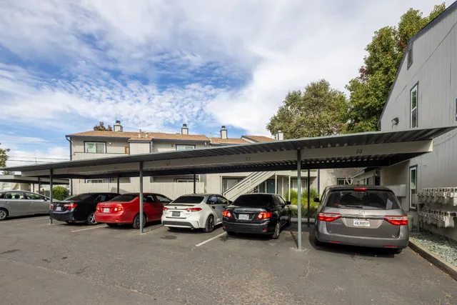 a view of parking space with cars