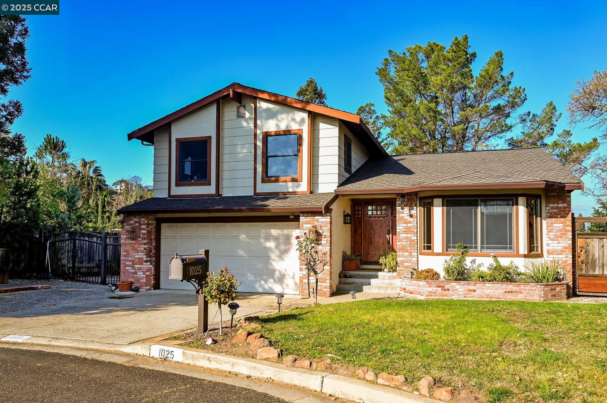 1025 Pine Meadows Court Martinez, CA 94553 - Photo 1 of 1 a front view of a house with garden