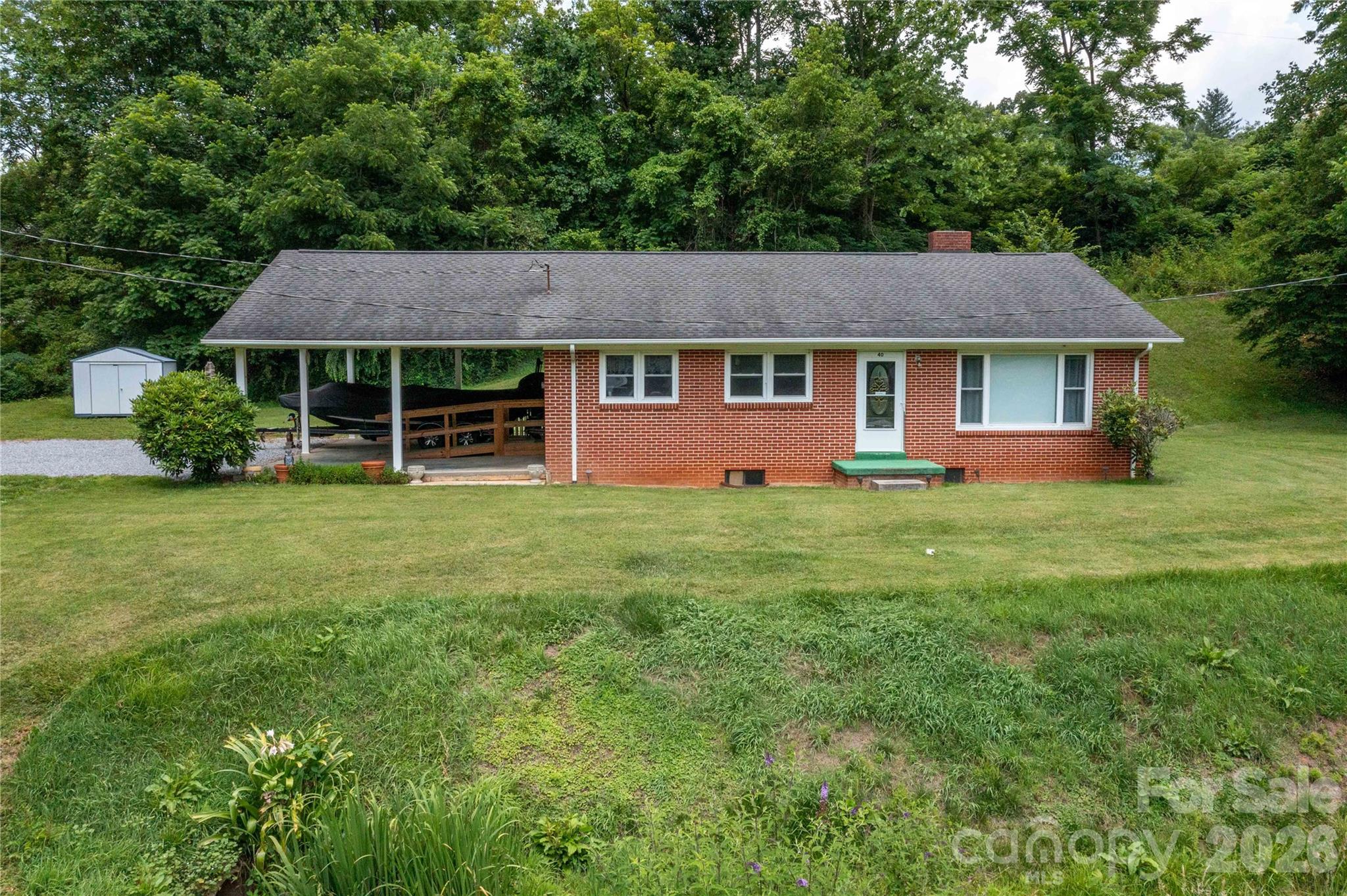 40 Double Island Road Burnsville, NC 28714 - Photo 36 of 38 a view of a house with yard and tree s