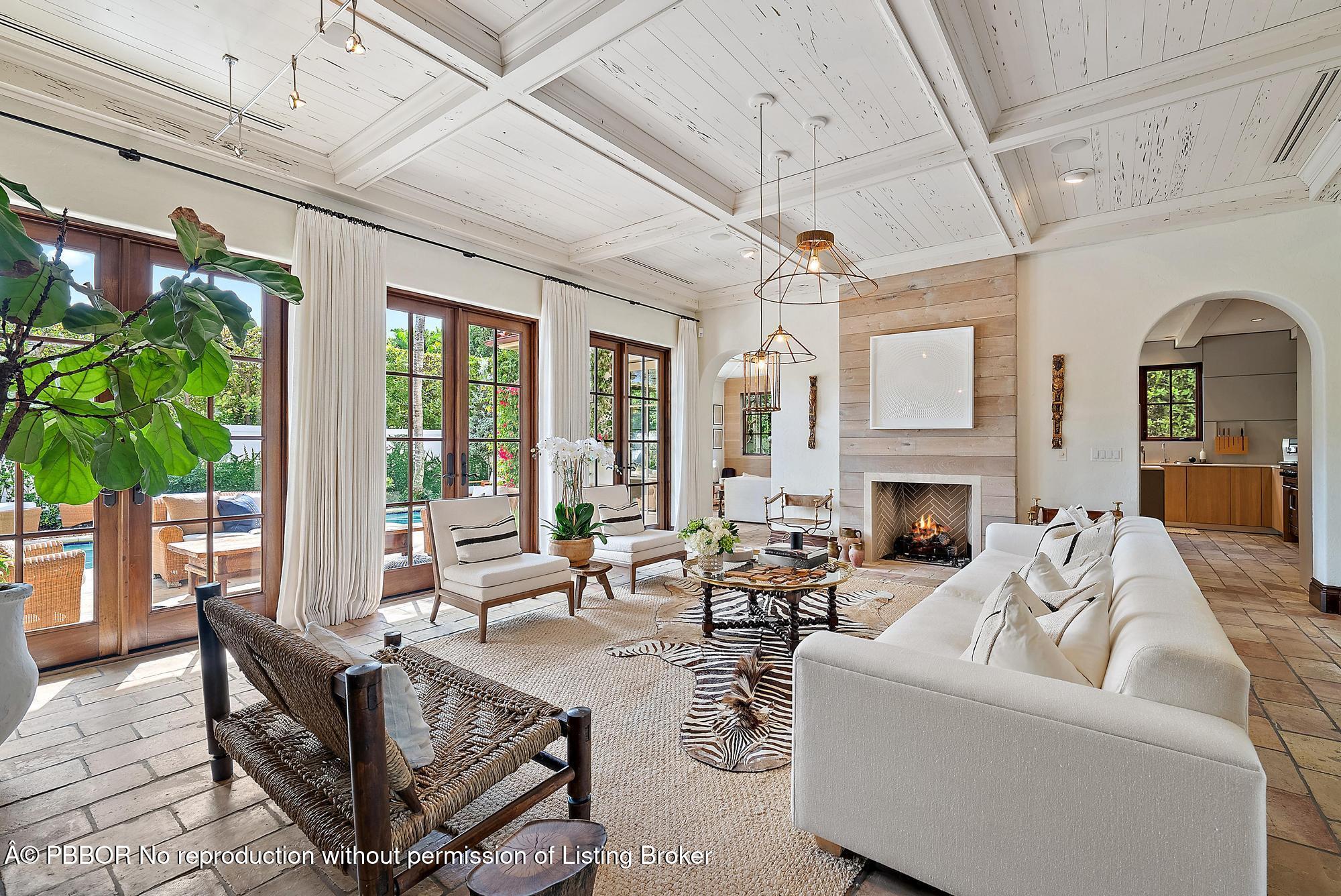 234 Ridgeview Drive Palm Beach, FL 33480 - Photo 3 of 20 a living room with furniture a fireplace and a potted plant