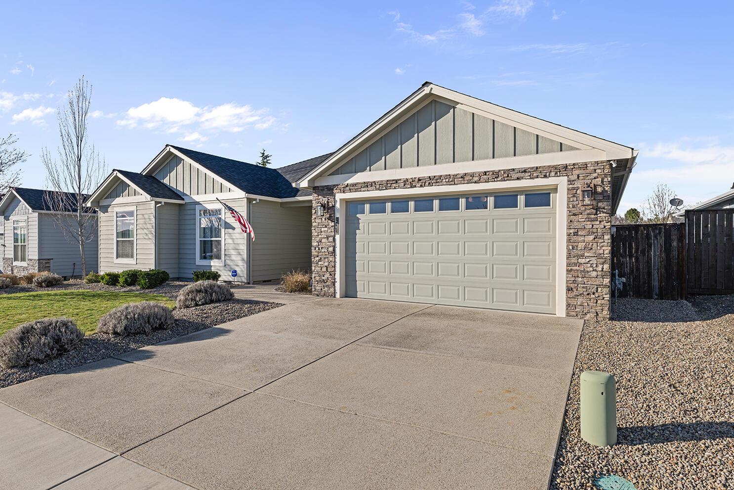 1043 Arrowhead Trail Eagle Point, OR 97524 - Photo 1 of 29 a front view of a house with a yard and garage