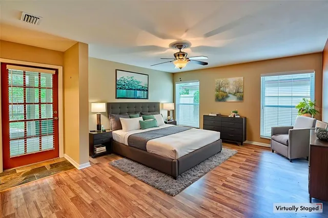 a bedroom with a large bed and a window