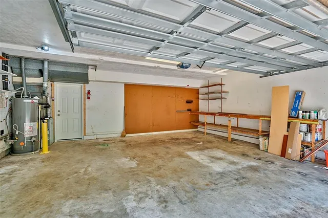 a view of empty room with wooden ceiling