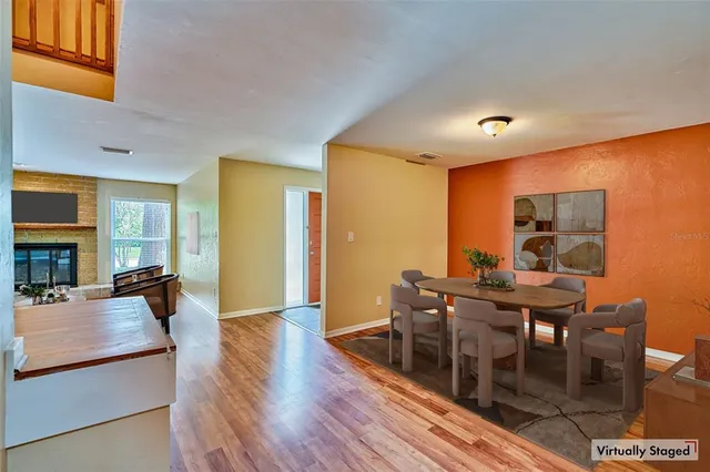a view of a dining room with furniture window and wooden floor