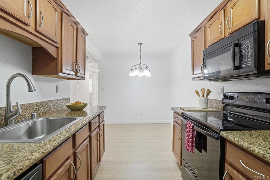 4455 Home Avenue, Unit 2 San Diego, CA 92105 - Photo 13 of 28 a kitchen that has a sink and a stove