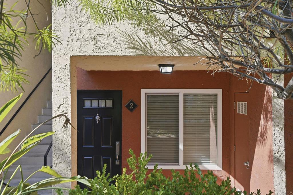4455 Home Avenue, Unit 2 San Diego, CA 92105 - Photo 3 of 28 a front view of a house with a tree