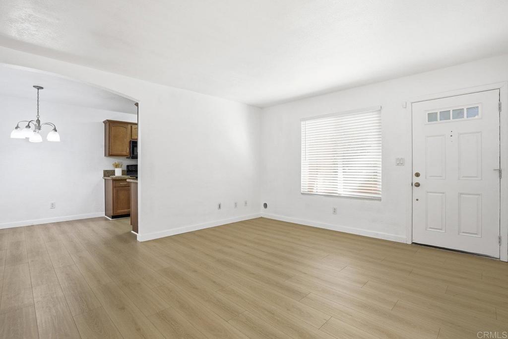 4455 Home Avenue, Unit 2 San Diego, CA 92105 - Photo 6 of 28 an empty room with wooden floor closet and windows