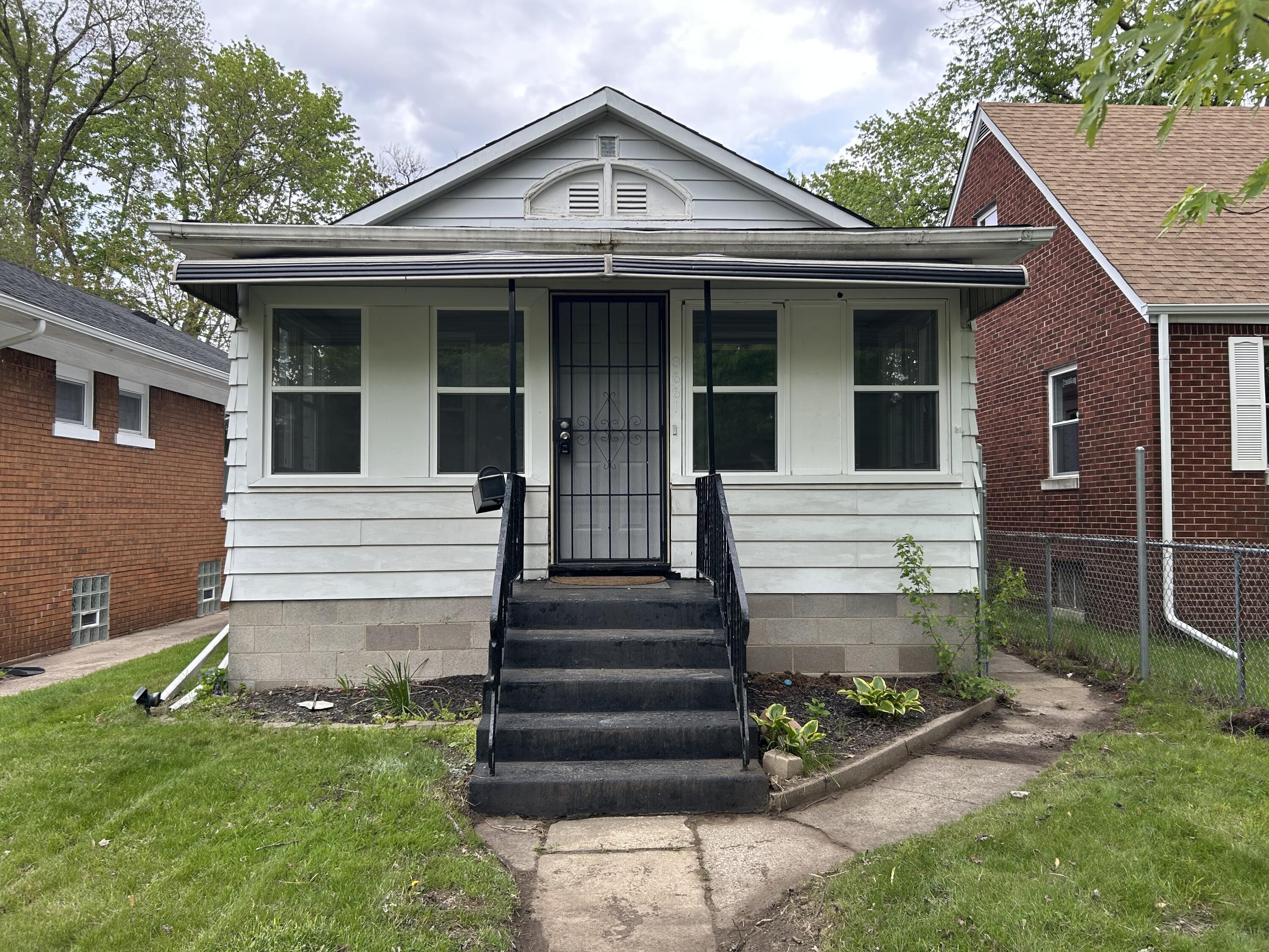 3661 Connecticut Street Gary, IN 46409 - Photo 1 of 17 a front view of a house with garden