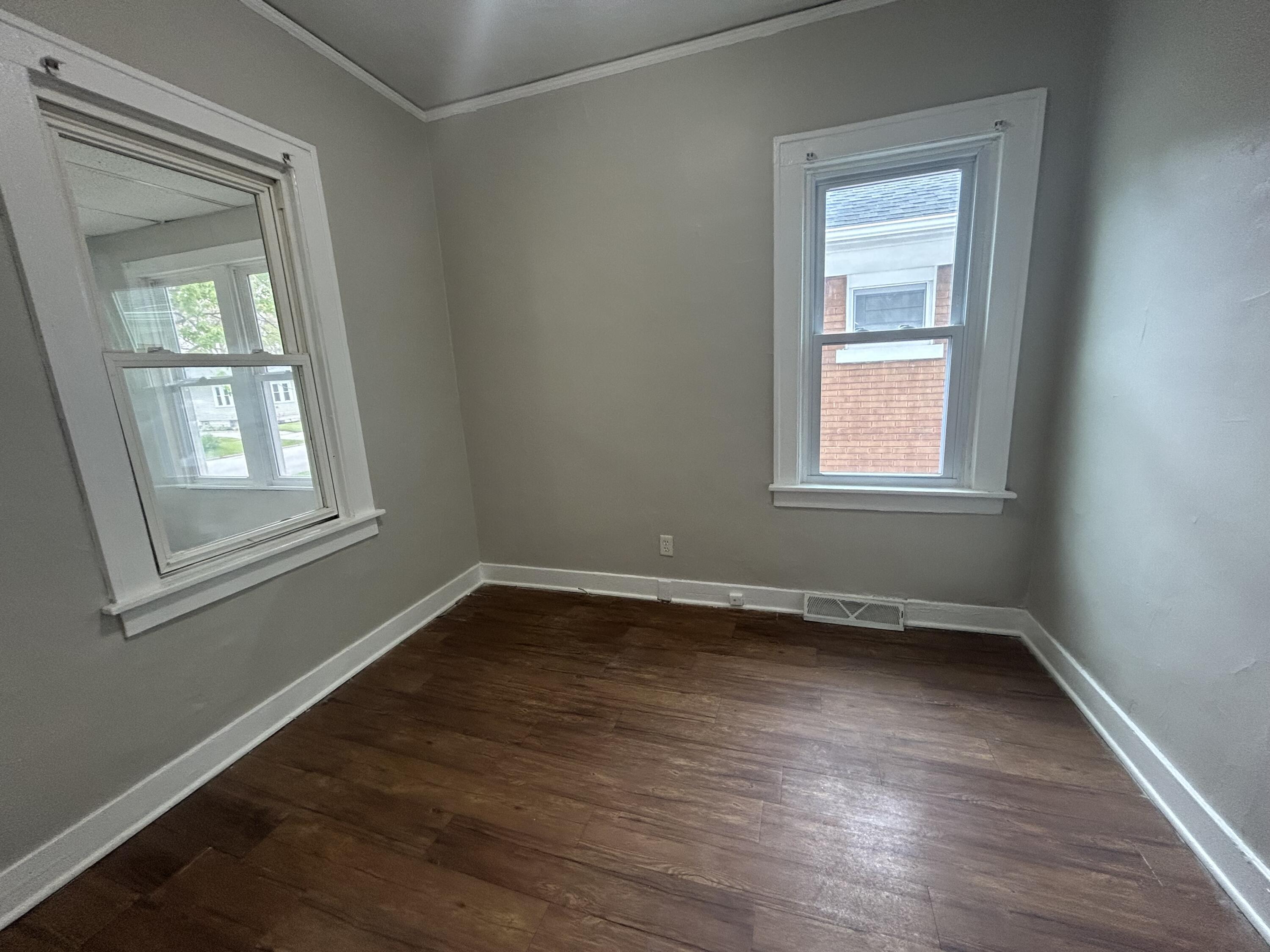 3661 Connecticut Street Gary, IN 46409 - Photo 13 of 17 an empty room with wooden floor and windows