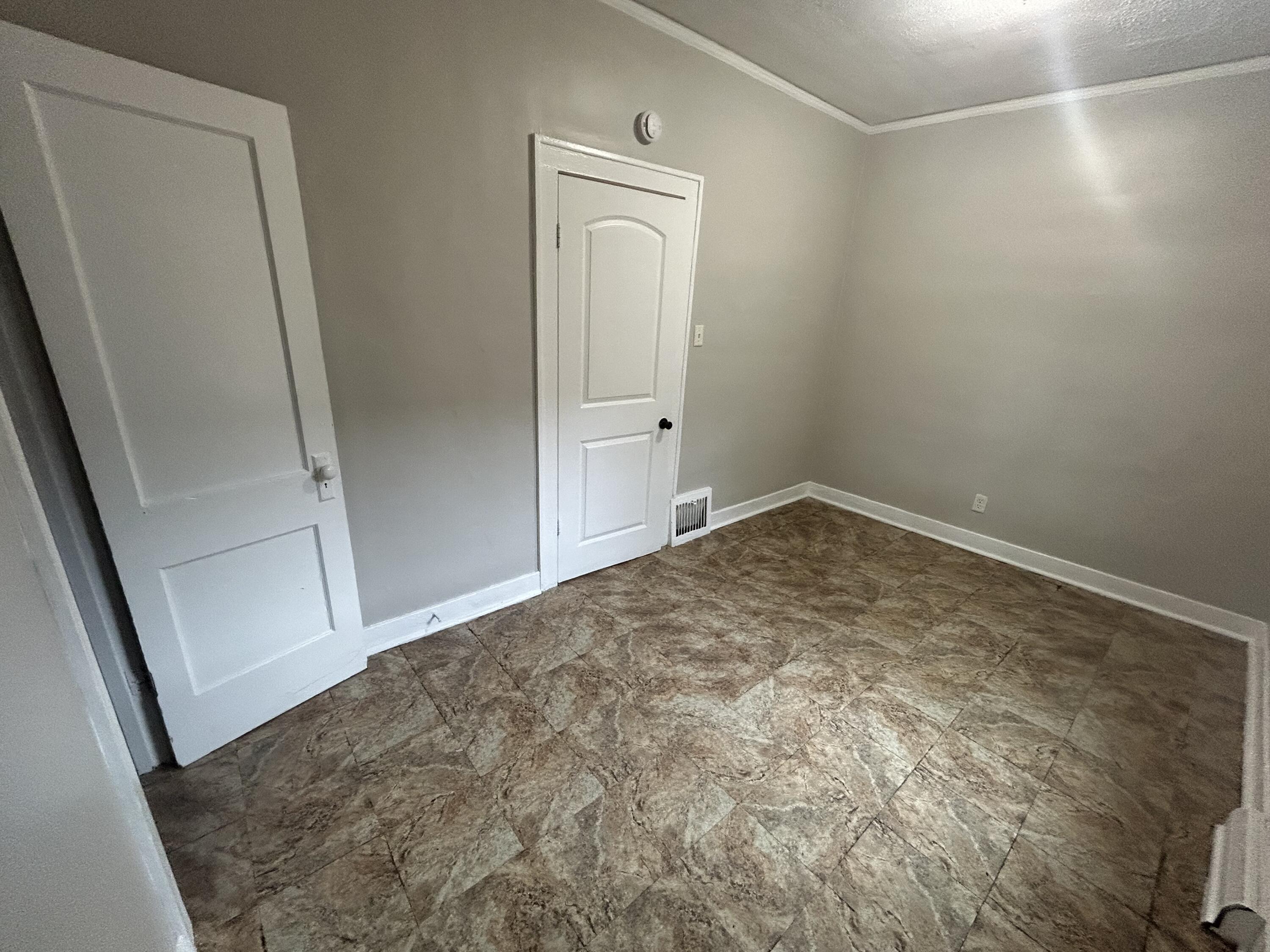 3661 Connecticut Street Gary, IN 46409 - Photo 6 of 17 an empty room with mirror