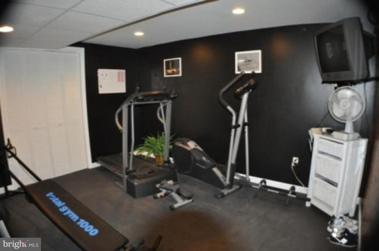 4807 Dave Rill Road Hampstead, MD 21074 - Photo 14 of 25 a room with gym equipment and windows