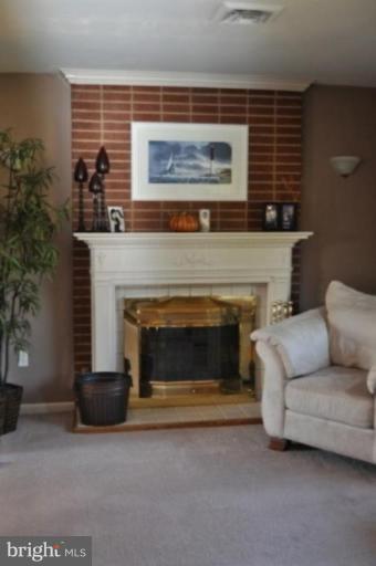 4807 Dave Rill Road Hampstead, MD 21074 - Photo 22 of 25 a living room with furniture and a fireplace