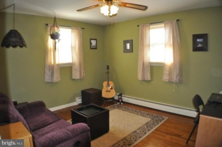 4807 Dave Rill Road Hampstead, MD 21074 - Photo 9 of 25 a living room with furniture and a window