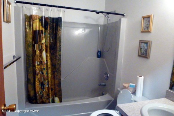 825 Hampstead Road Bushkill, PA 18324 - Photo 13 of 21 a bathroom with a shower and a toilet