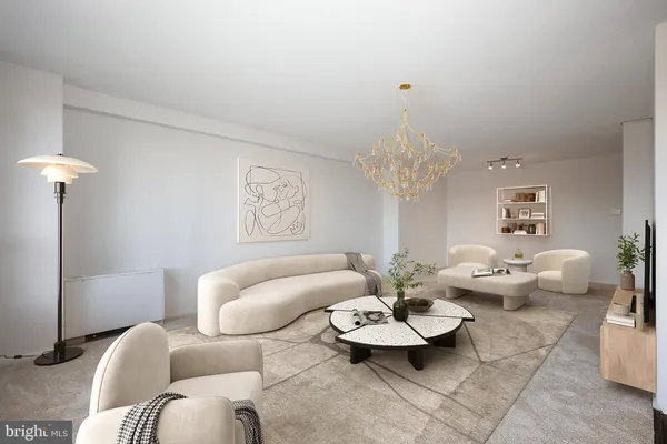 a living room with furniture and a chandelier