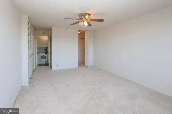 a view of an empty room with a bathroom