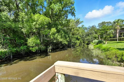 a view of a chair and tables in the patio