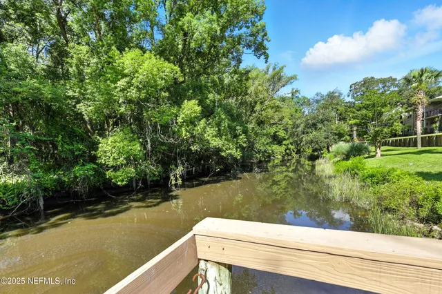 a view of a chair and tables in the patio
