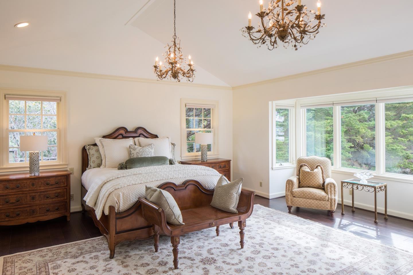 1476 Bonifacio Road Pebble Beach, CA 93953 - Photo 11 of 39 a bedroom with a bed and a chair