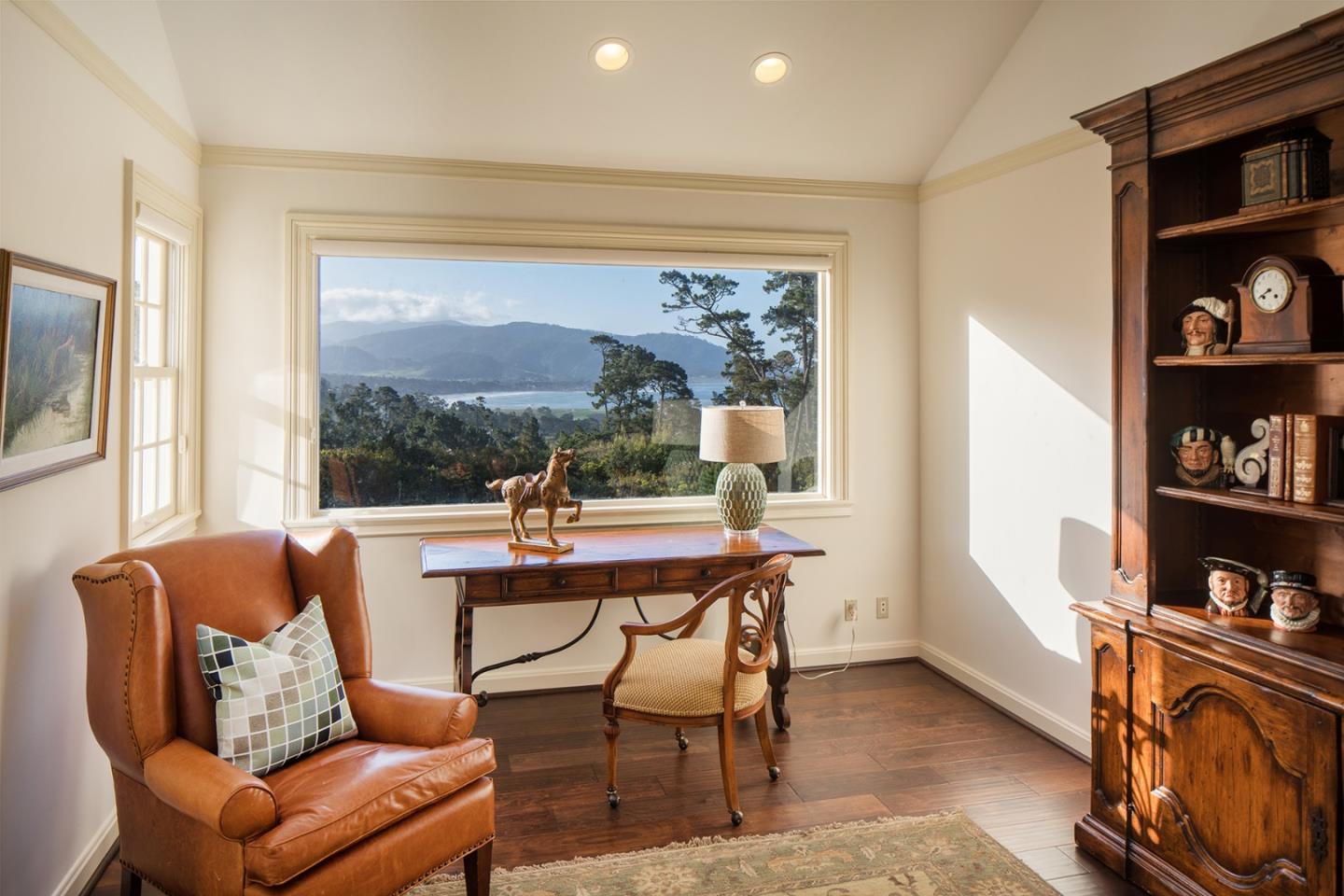 1476 Bonifacio Road Pebble Beach, CA 93953 - Photo 19 of 39 a room with furniture wooden floor and a window