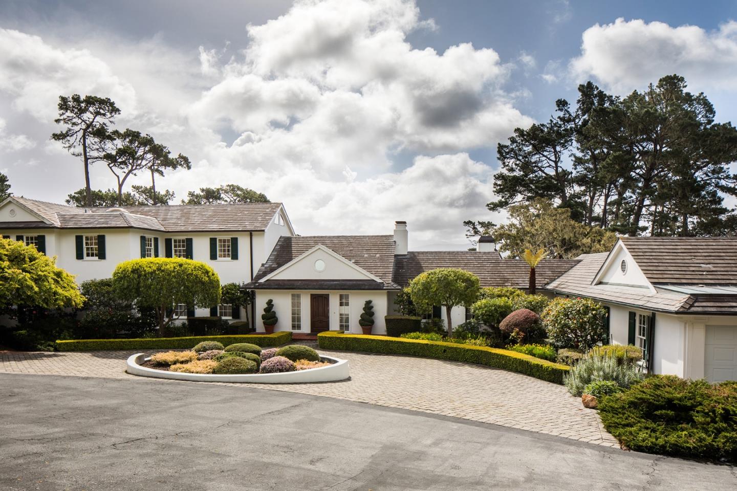 1476 Bonifacio Road Pebble Beach, CA 93953 - Photo 2 of 39 a front view of a house with swimming pool having outdoor seating