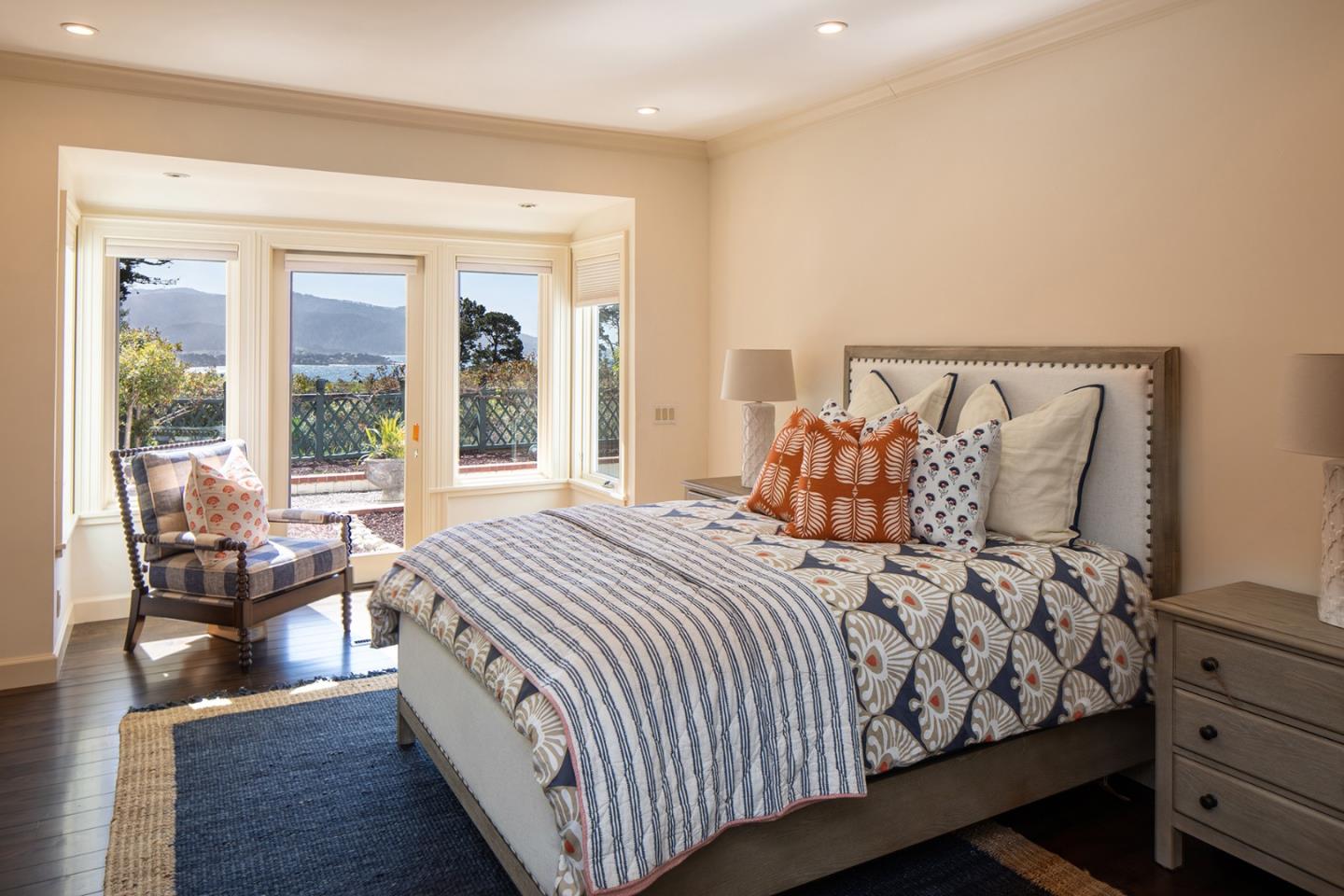 1476 Bonifacio Road Pebble Beach, CA 93953 - Photo 22 of 39 a bed room with a bed and a large window