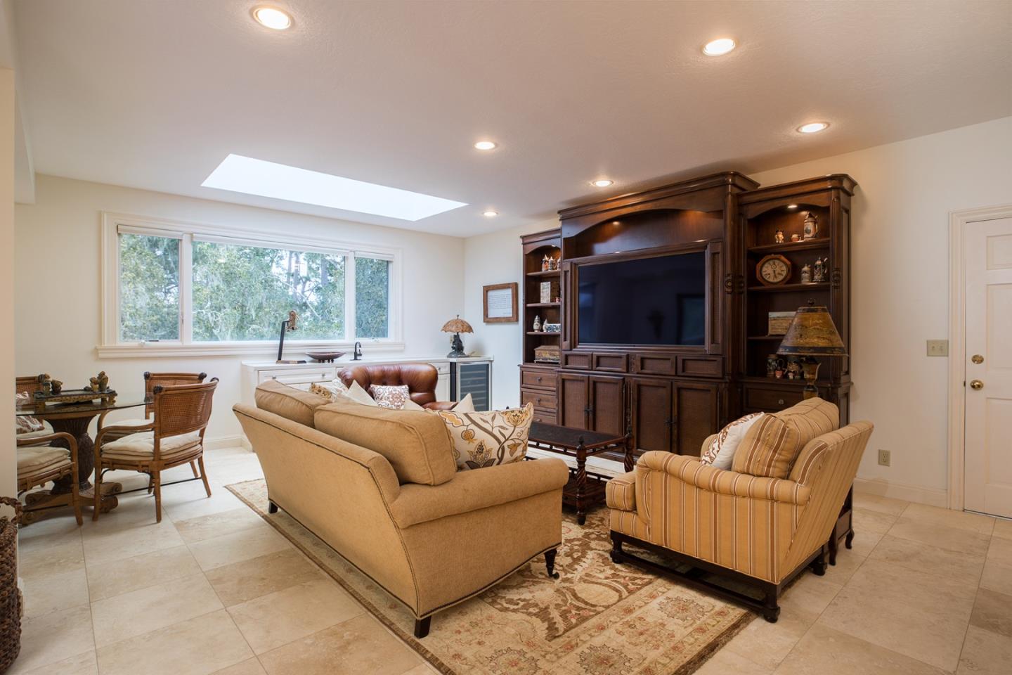 1476 Bonifacio Road Pebble Beach, CA 93953 - Photo 25 of 39 a living room with furniture and a flat screen tv
