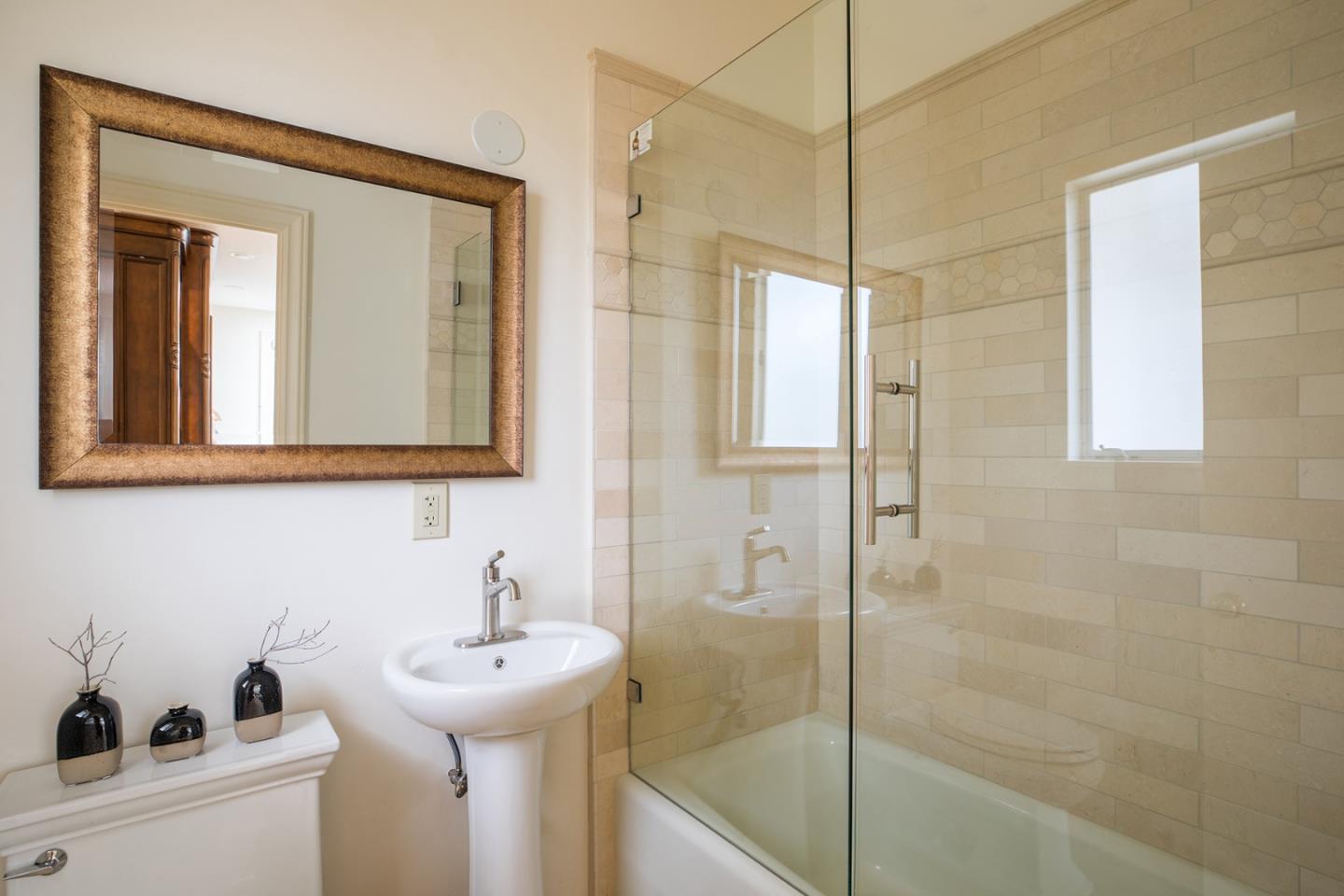1476 Bonifacio Road Pebble Beach, CA 93953 - Photo 26 of 39 a bathroom with a sink and a mirror