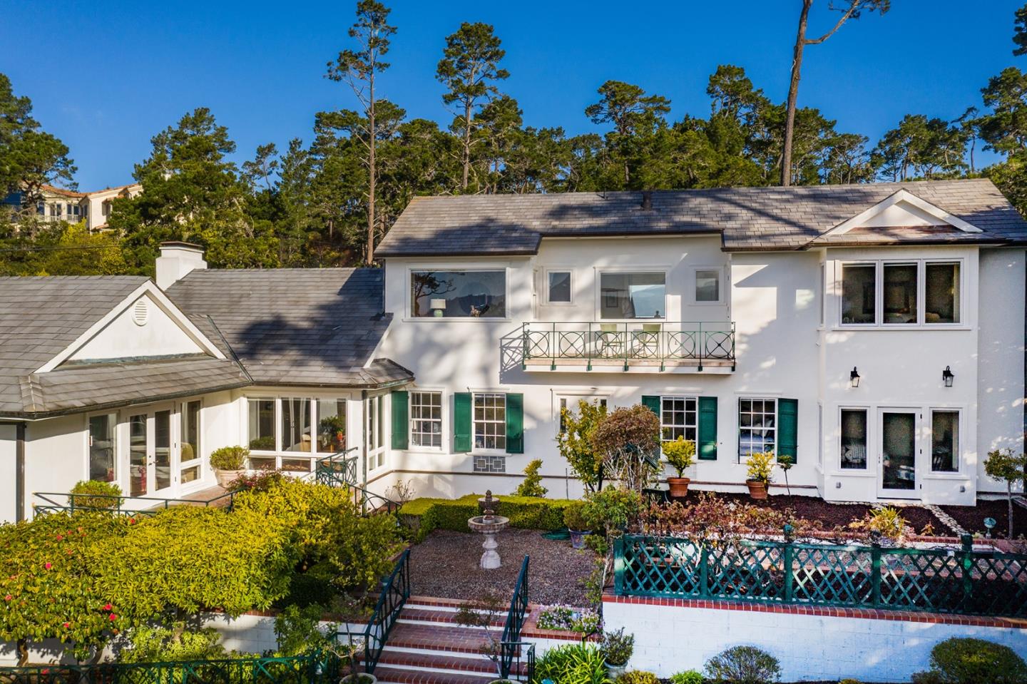 1476 Bonifacio Road Pebble Beach, CA 93953 - Photo 28 of 39 a front view of a house with a yard
