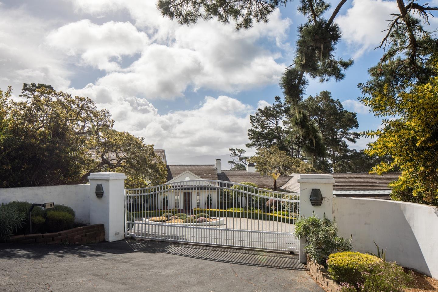1476 Bonifacio Road Pebble Beach, CA 93953 - Photo 36 of 39 a front view of a house with garden