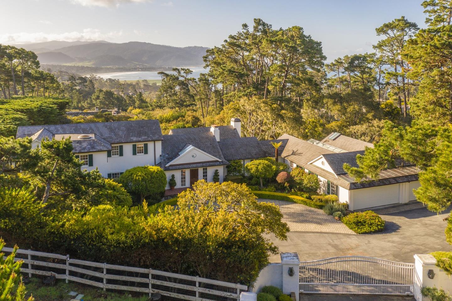 1476 Bonifacio Road Pebble Beach, CA 93953 - Photo 37 of 39 a view of a house with a yard