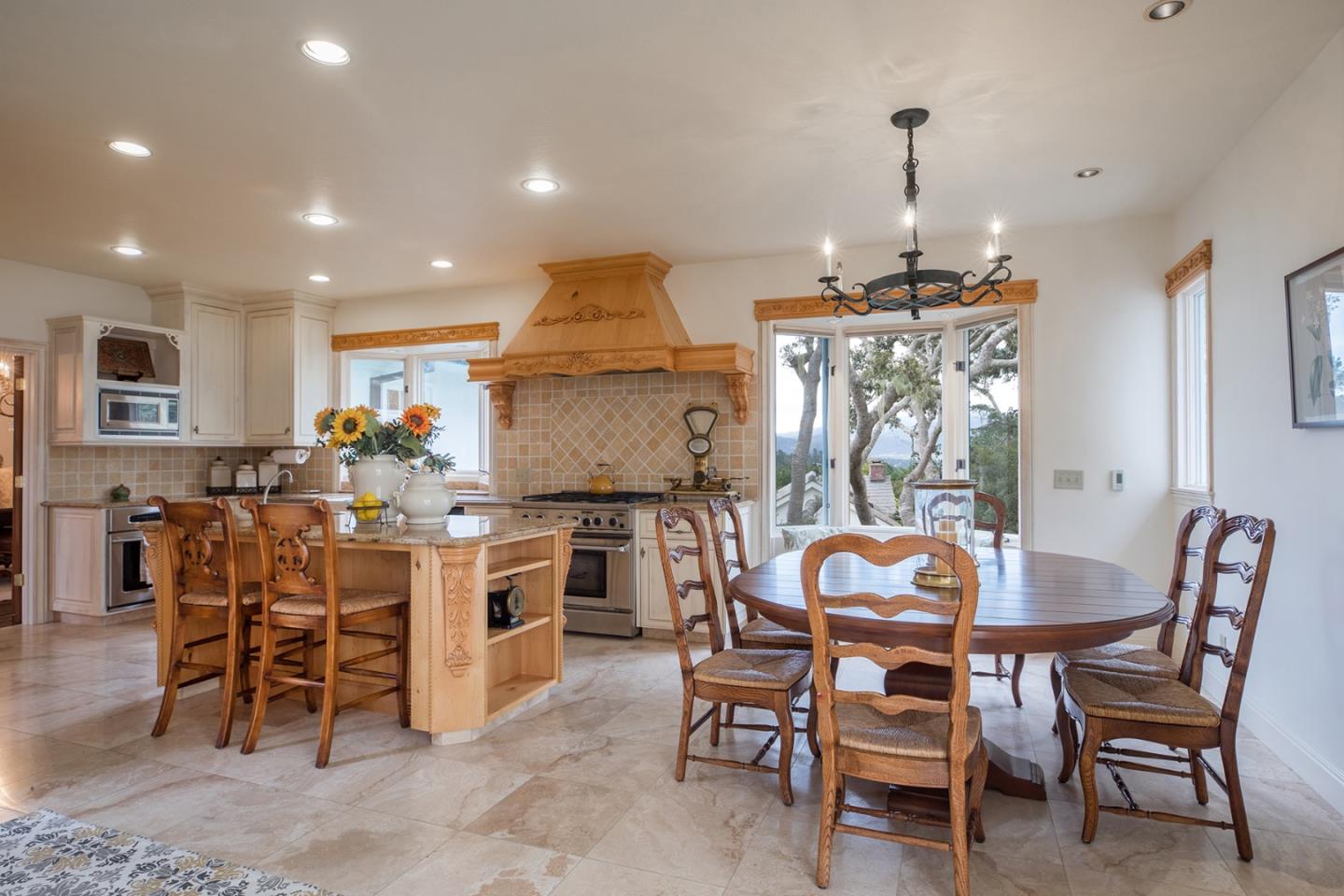 1476 Bonifacio Road Pebble Beach, CA 93953 - Photo 8 of 39 a view of a dining room with furniture window and wooden floor