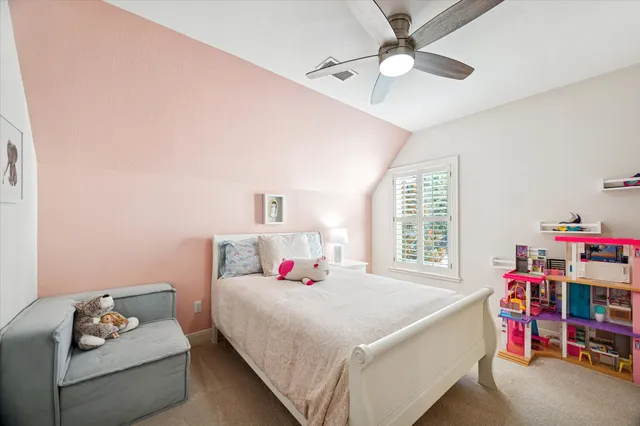 a bed room with a bed and a window