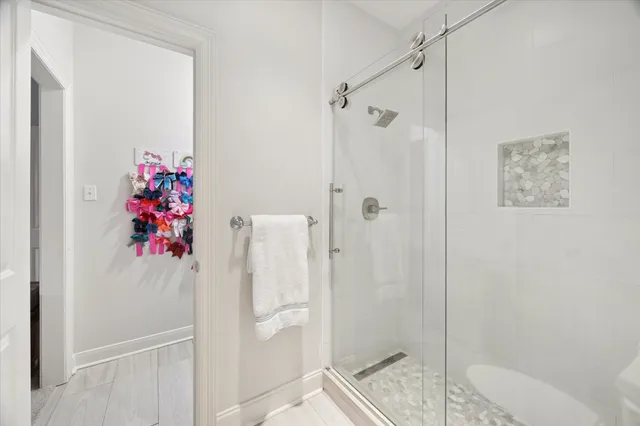 a bathroom with a shower and a toilet