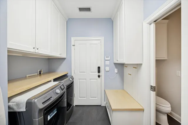 a view of a kitchen with storage and utility