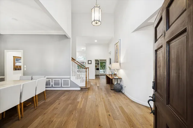 a view of living room with furniture and wooden floor