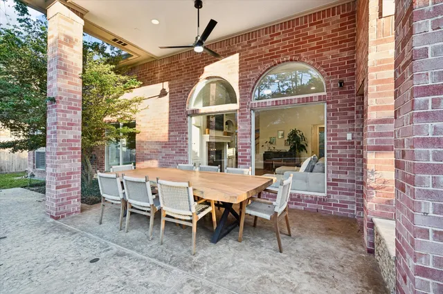 a view of a house with a porch and a table and chairs