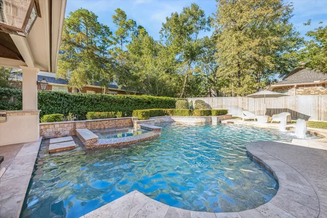 swimming pool view with a outdoor seating