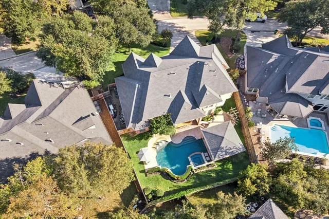 an aerial view of a house with outdoor space