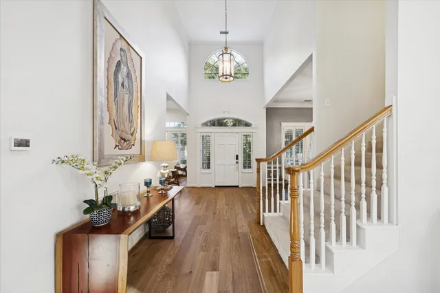 a view of an entryway with wooden floor