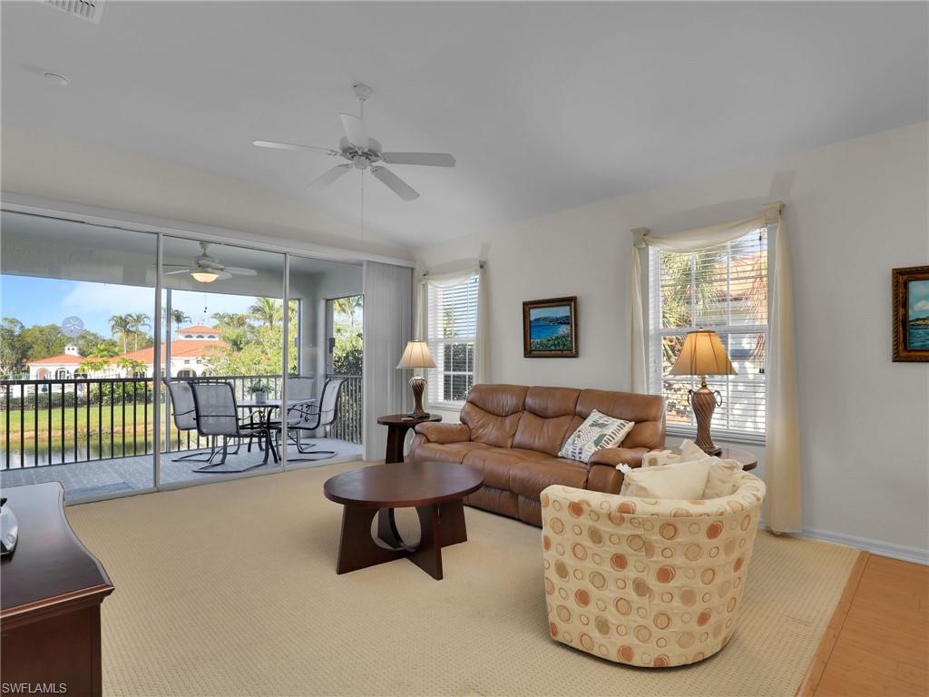 23731 Eddystone Road, Unit 6204 Estero, FL 34135 - Photo 18 of 30 a living room with furniture and a table