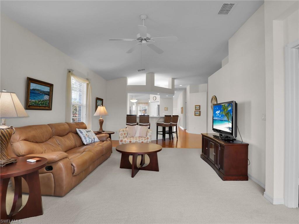 23731 Eddystone Road, Unit 6204 Estero, FL 34135 - Photo 19 of 30 a living room with furniture and a flat screen tv