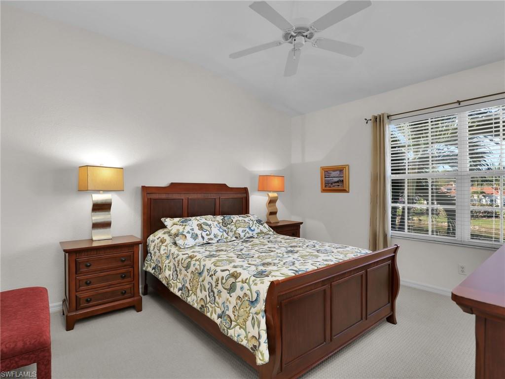 23731 Eddystone Road, Unit 6204 Estero, FL 34135 - Photo 20 of 30 a bedroom with a bed window and a dresser