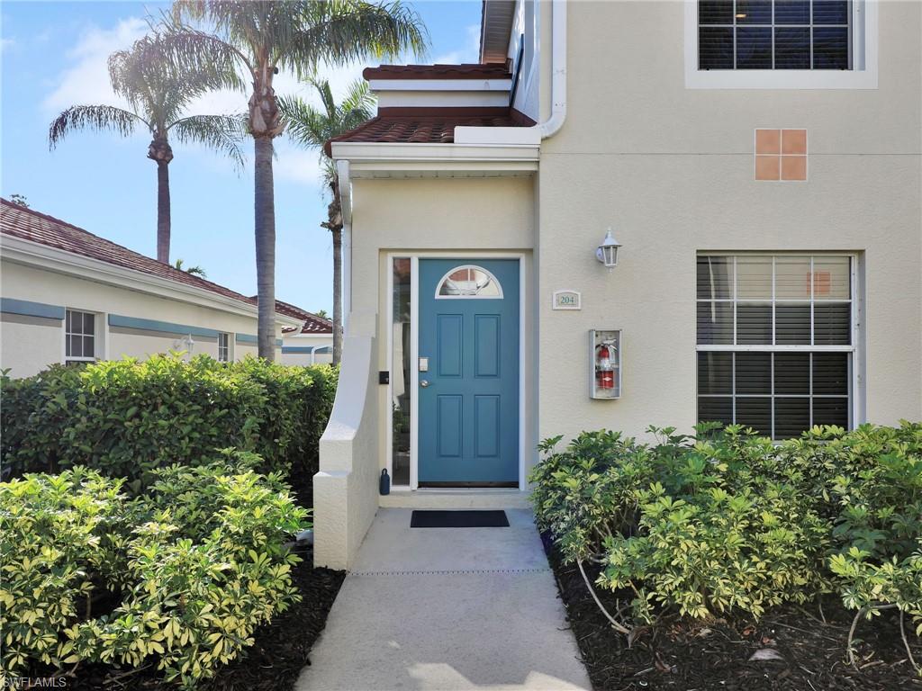 23731 Eddystone Road, Unit 6204 Estero, FL 34135 - Photo 6 of 30 a front view of a house with a garden
