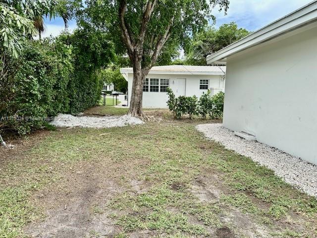 3801 Ponce De Leon, Unit EFFICIENCY Coral Gables, FL 33134 - Photo 14 of 16 a house with trees in front of it