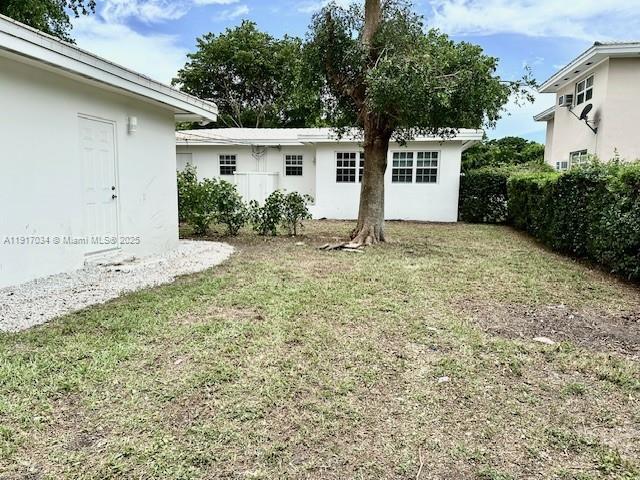 3801 Ponce De Leon, Unit EFFICIENCY Coral Gables, FL 33134 - Photo 16 of 16 a house with a yard