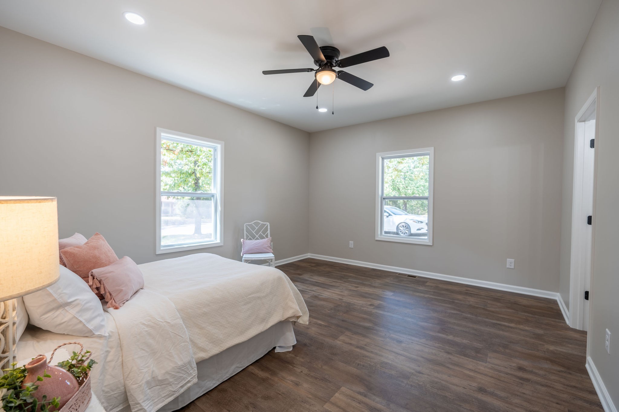 413 Market Street Waynesboro, TN 38485 - Photo 10 of 17 a bedroom with a large bed window and a chandelier