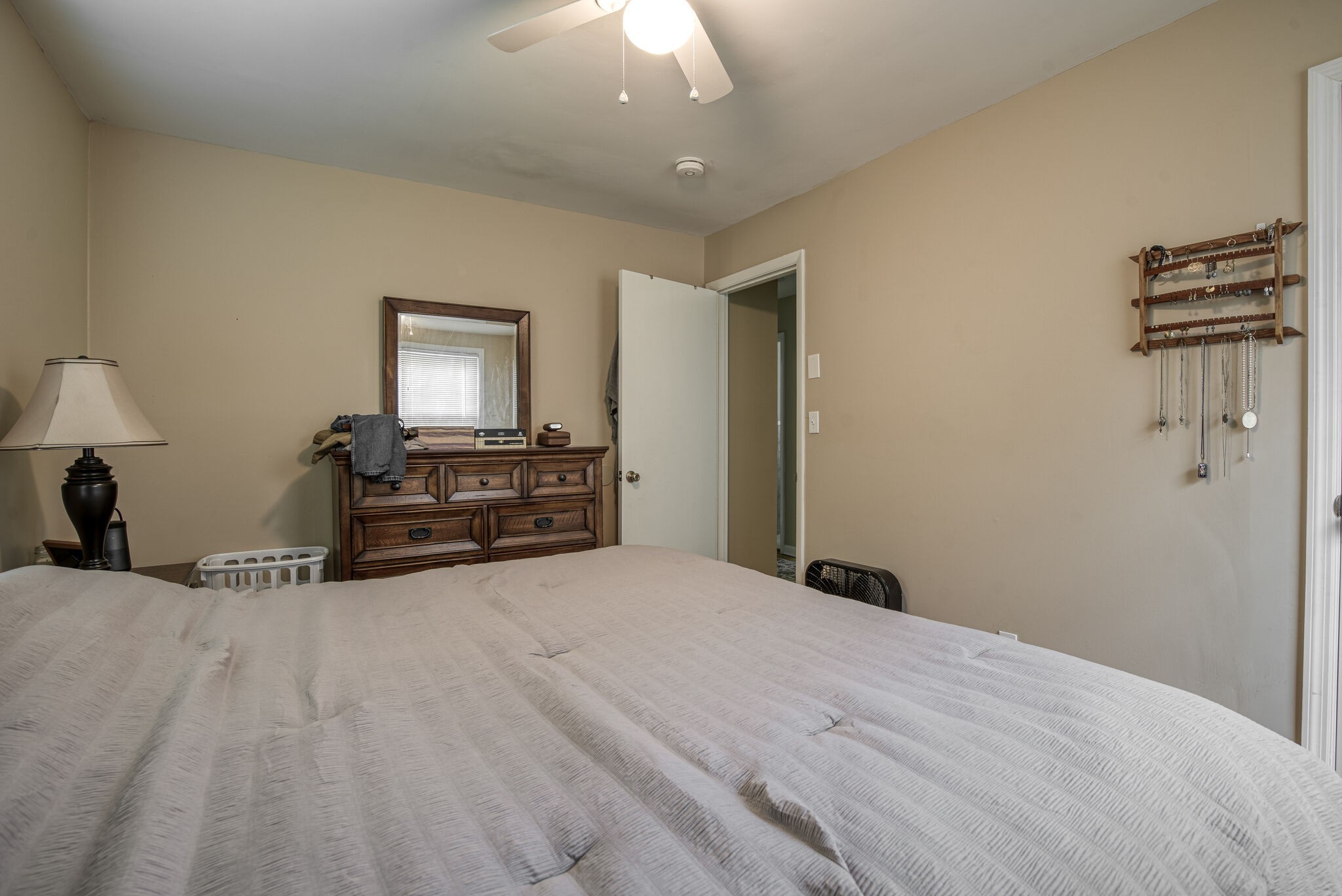 45 Benzing Road Antioch, TN 37013 - Photo 15 of 25 a bedroom with a bed and a chandelier