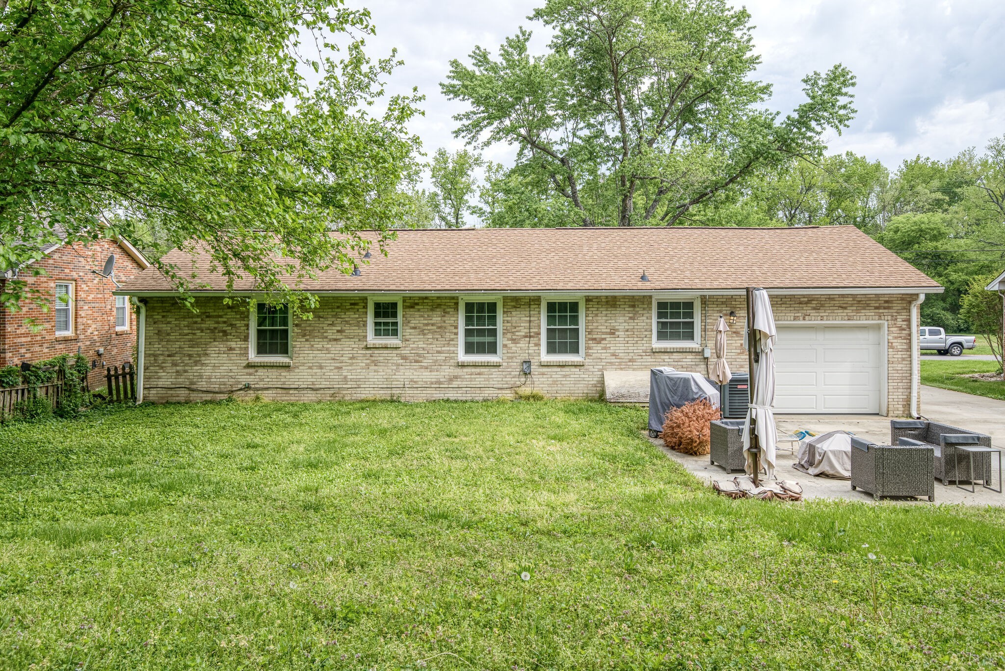 45 Benzing Road Antioch, TN 37013 - Photo 23 of 25 a backyard of a house with table and chairs